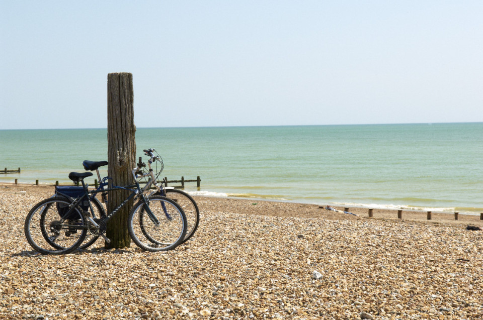 Bikes propped up on the beach